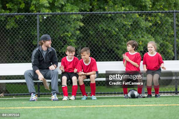 kids practicing soccer at camp - side lines imagens e fotografias de stock