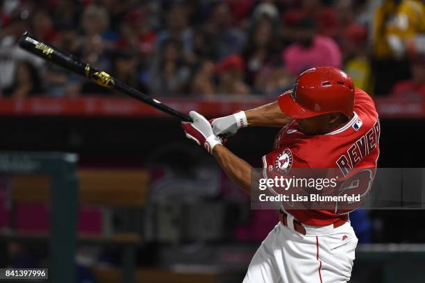 Ben Revere of the Los Angeles Angels of Anaheim hits a single in the second inning against the Texas Rangers at Angel Stadium of Anaheim on August...