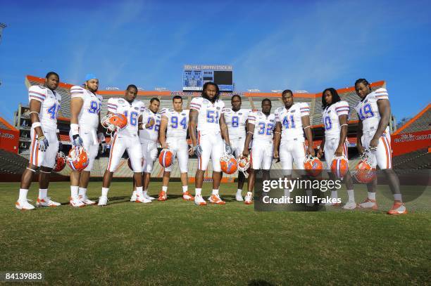 Portrait of Florida defensive players Brandon Hicks , Lawrence Marsh , A.J. Jones , Terron Sanders , Justin Trattou , Brandon Spikes , Carlos Dunlap...