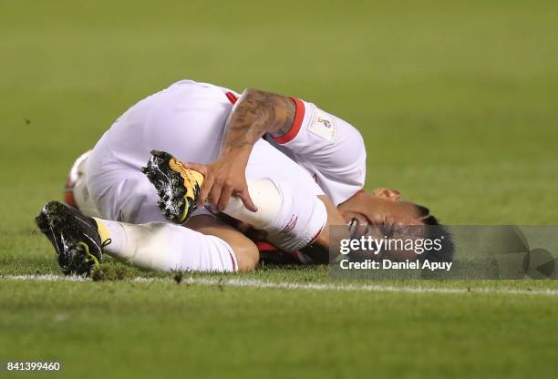 Christian Cueva of Peru lies on the grass during a match between Peru and Bolivia as part of FIFA 2018 World Cup Qualifiers at Monumental Stadium on...