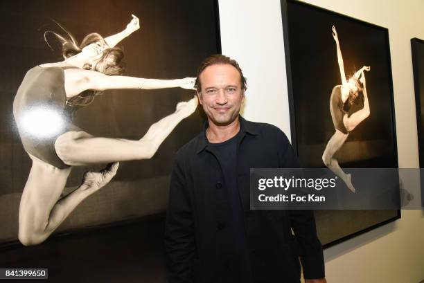 Actor/photographer Vincent Perez poses with his work during 'Bolchoi' Vincent Perez Photo Exhibition Preview at Royal Monceau on August 31, 2017 in...