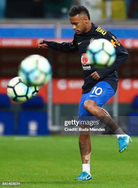 Neymar of Brazil warms up before a match between Brazil and Ecuador as part of 2018 FIFA World Cup Russia Qualifier at Arena do Gremio on August 31,...