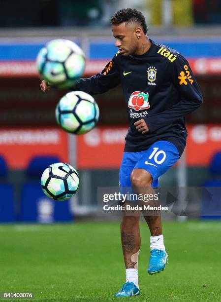 Neymar of Brazil warms up before a match between Brazil and Ecuador as part of 2018 FIFA World Cup Russia Qualifier at Arena do Gremio on August 31,...