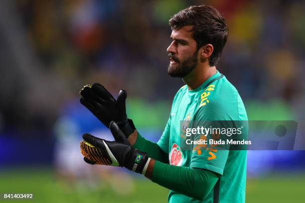 Goalkeeper Alisson of Brazil warms up before a match between Brazil and Ecuador as part of 2018 FIFA World Cup Russia Qualifier at Arena do Gremio on...