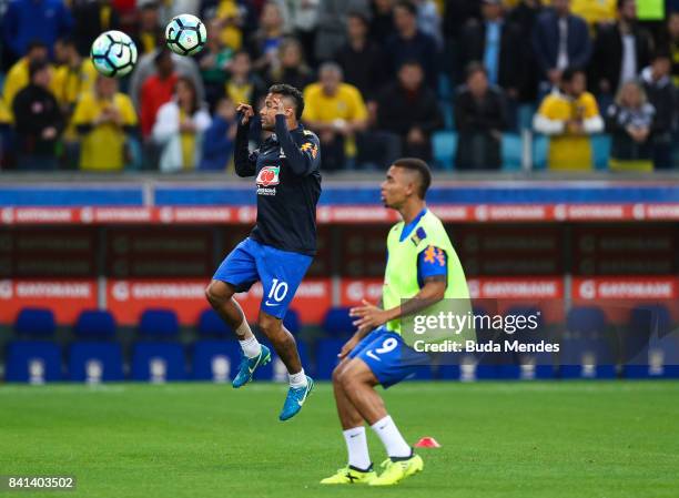 Neymar and Grabiel Jesus of Brazil warm up before a match between Brazil and Ecuador as part of 2018 FIFA World Cup Russia Qualifier at Arena do...