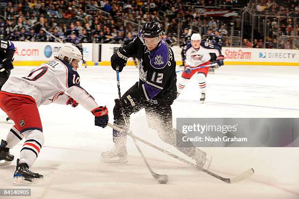 Kris Russell of the Columbus Blue Jackets defends against Patrick O'Sullivan of the Los Angeles Kings during the game on December 29, 2008 at Staples...