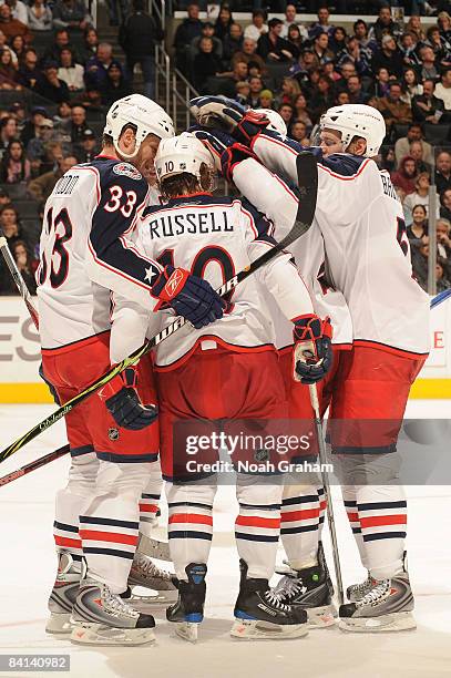 The Columbus Blue Jackets celebrate a second period goal from teammate Kris Russell against the Los Angeles Kings during the game on December 29,...