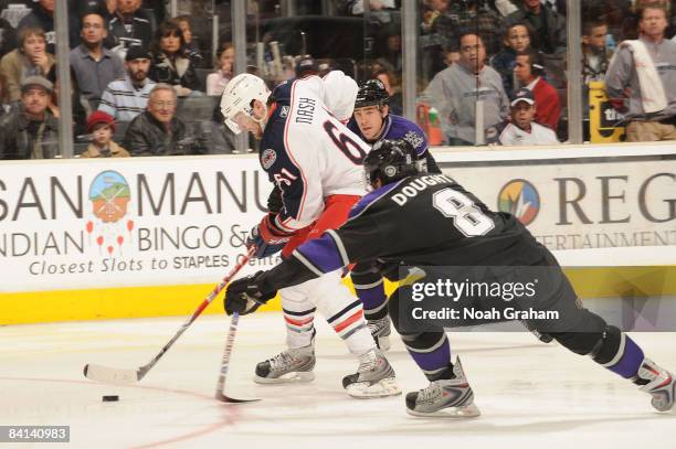 Rick Nash of the Columbus Blue Jackets defends the puck against Drew Doughty of the Los Angeles Kings during the game on December 29, 2008 at Staples...