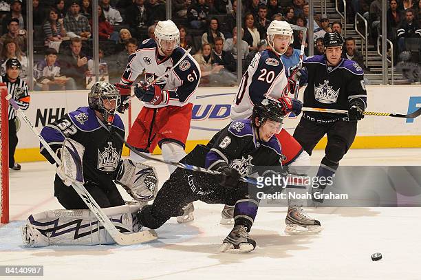 Jonathan Quick and Drew Doughty of the Los Angeles Kings defends the net against Rick Nash and Kristian Huselius of the Columbus Blue Jackets during...
