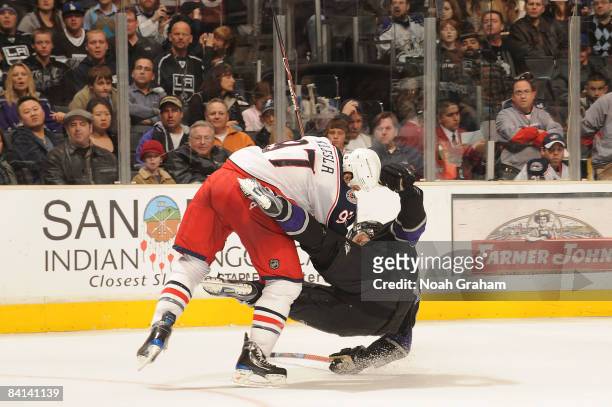 Rostislav Klesla of the Columbus Blue Jackets collides into Michal Handzus of the Los Angeles Kings during the game on December 29, 2008 at Staples...