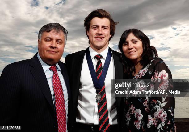 Rising star winner Andrew McGrath of the Bombers poses for a photo with parents Michael and Sandy McGrath during the 2017 NAB AFL Rising Star awards...