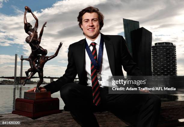 Andrew McGrath of the Bombers holds the trophy and Ron Evans medal for the Rising Star award during the 2017 NAB AFL Rising Star awards at Peninsula...