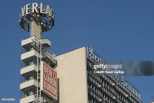 Logos of two Berlin daily newspapers, "Berliner Zeitung" and "Berliner Kurier," are seen at the headquarters of their parent publisher, Berliner...