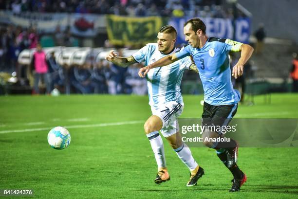 Mauro Icardi of Argentina and Diego Godin of Uruguay vie for the ball during the 2018 FIFA World Cup qualifying match between Uruguay and Argentina...