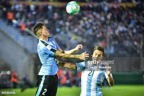 Jose Maria Gimenez of Uruguay and Paulo Dybala of Argentina vie for the ball during the 2018 FIFA World Cup qualifying match between Uruguay and...