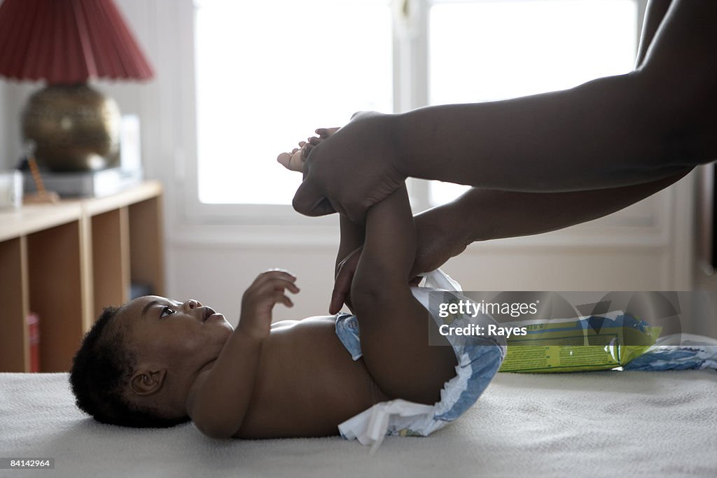 Baby having his nappy changed