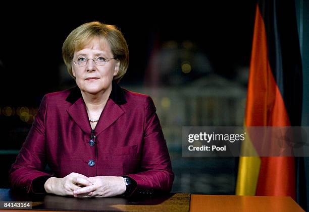 German Chancellor Angela Merkel poses for the photographer after the taping of her annual New Year broadcast at the chancellery on December 30, 2008...