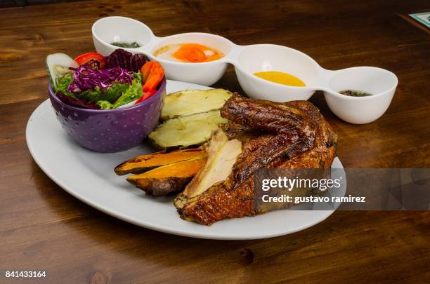 traditional chancho al cilindro peruvian food - chancho stockfoto's en -beelden