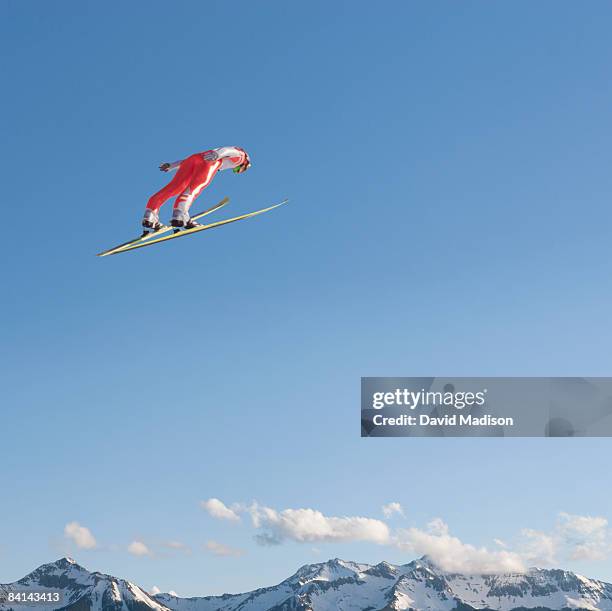 ski jumper flying through air - freestyle skiing stock pictures, royalty-free photos & images