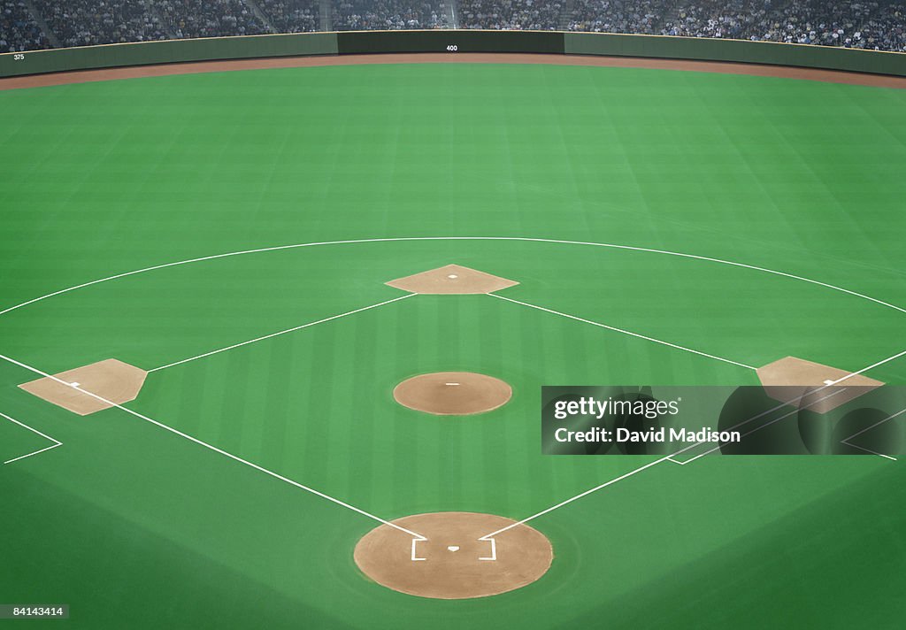 Baseball field with crowd in background