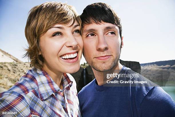 happy young couple cheek to cheek  - 面貼面 個照片及圖片檔