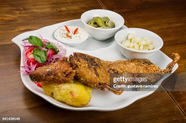 peruvian food guinea pig - peruvian guinea pig stock pictures, royalty-free photos & images