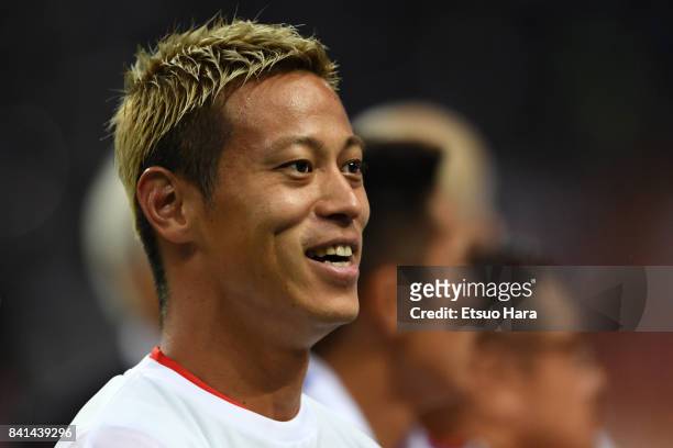 Keisuke Honda of Japan celebrates their 2-0 victory and qualified for the FIFA World Cup Russia after the FIFA World Cup Qualifier match between...