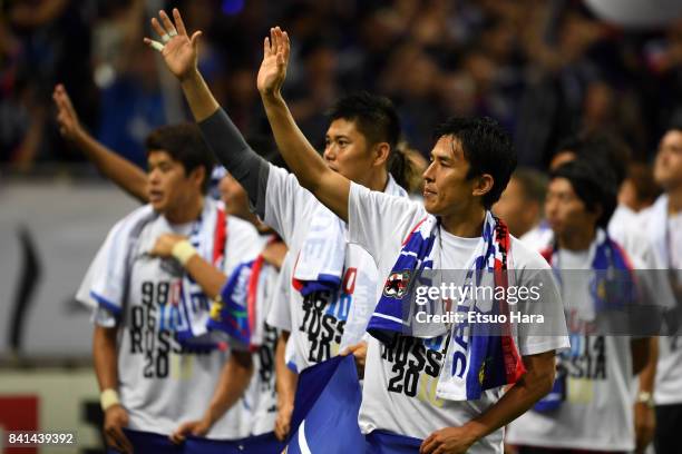 Japanese players celebrate their 2-0 victory and qualified for the FIFA World Cup Russia during the FIFA World Cup Qualifier match between Japan and...