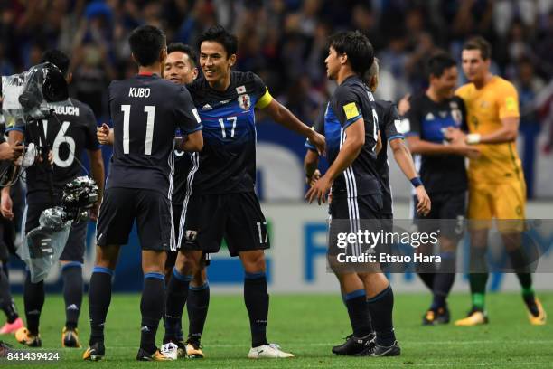 Makoto Hasebe and Japan players celebrate their 2-0 victory and qualified for the FIFA World Cup Russia after the FIFA World Cup Qualifier match...