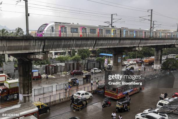 Train travels along a section of elevated track on Line 1, operated by the Mumbai Metro One Pvt. , a joint venture controlled by Reliance Industries...