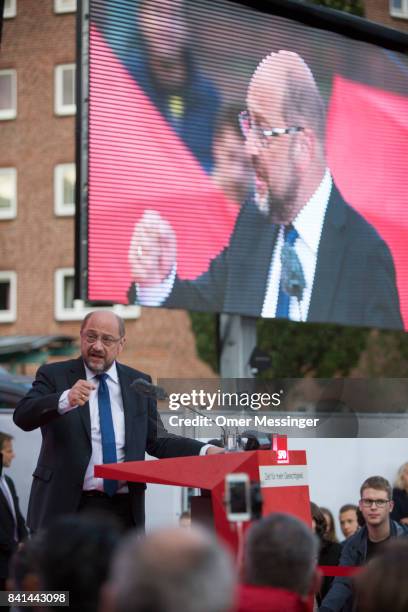 Martin Schulz, chancellor candidate of the German Social Democrats , speaks to voters at a "Martin Schulz live" election campaign stop on August 31,...