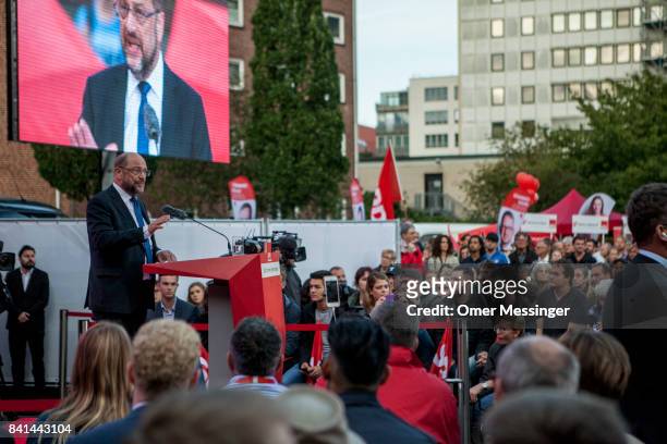 Martin Schulz, chancellor candidate of the German Social Democrats , speaks to voters at a "Martin Schulz live" election campaign stop on August 31,...