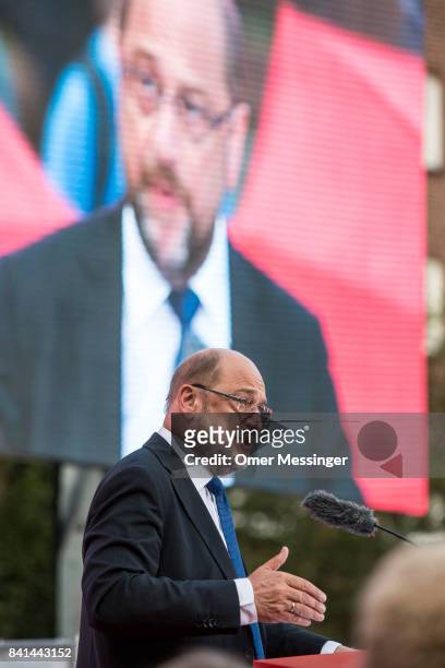 Martin Schulz, chancellor candidate of the German Social Democrats , speaks to voters at a "Martin Schulz live" election campaign stop on August 31,...