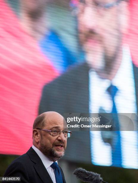 Martin Schulz, chancellor candidate of the German Social Democrats , speaks to voters at a "Martin Schulz live" election campaign stop on August 31,...