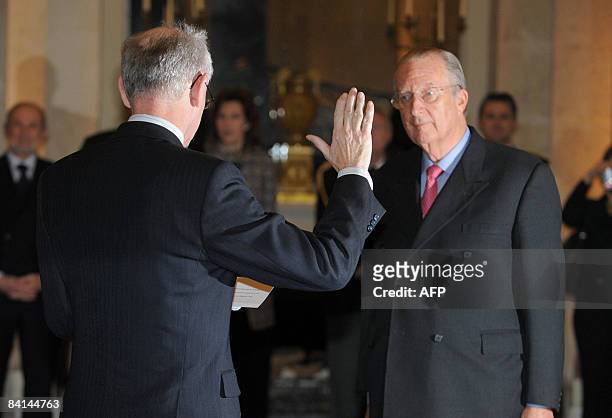 Belgian Herman Van Rompuy takes the oath as Prime Minister for King Albert II of Belgium at the Royal Palace in Laeken/Laken, during the swearing in...