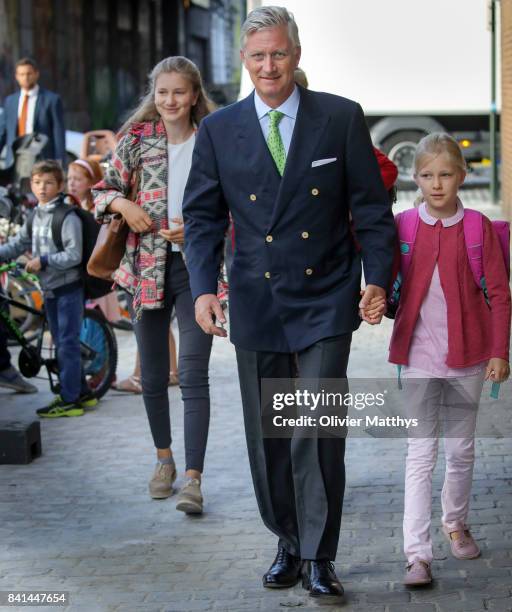 Princess Elisabeth of Belgium, King Philippe of Belgium and Princess Eleonore of Belgium arrive at the St John Bergmans college to attend the first...