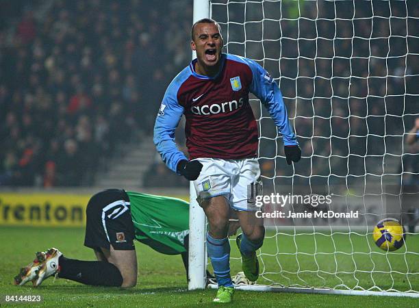 Gabriel Agbonlahor of Aston Villa celebrates after Kamil Zayatte of Hull City scored an own goal during the Barclays Premier League match between...