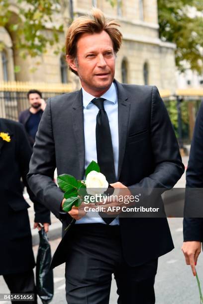 French journalist Laurent Delahousse arrives at the Saint-Sulpice church to attend the funeral of late actress Mireille Darc on September 1, 2017 in...