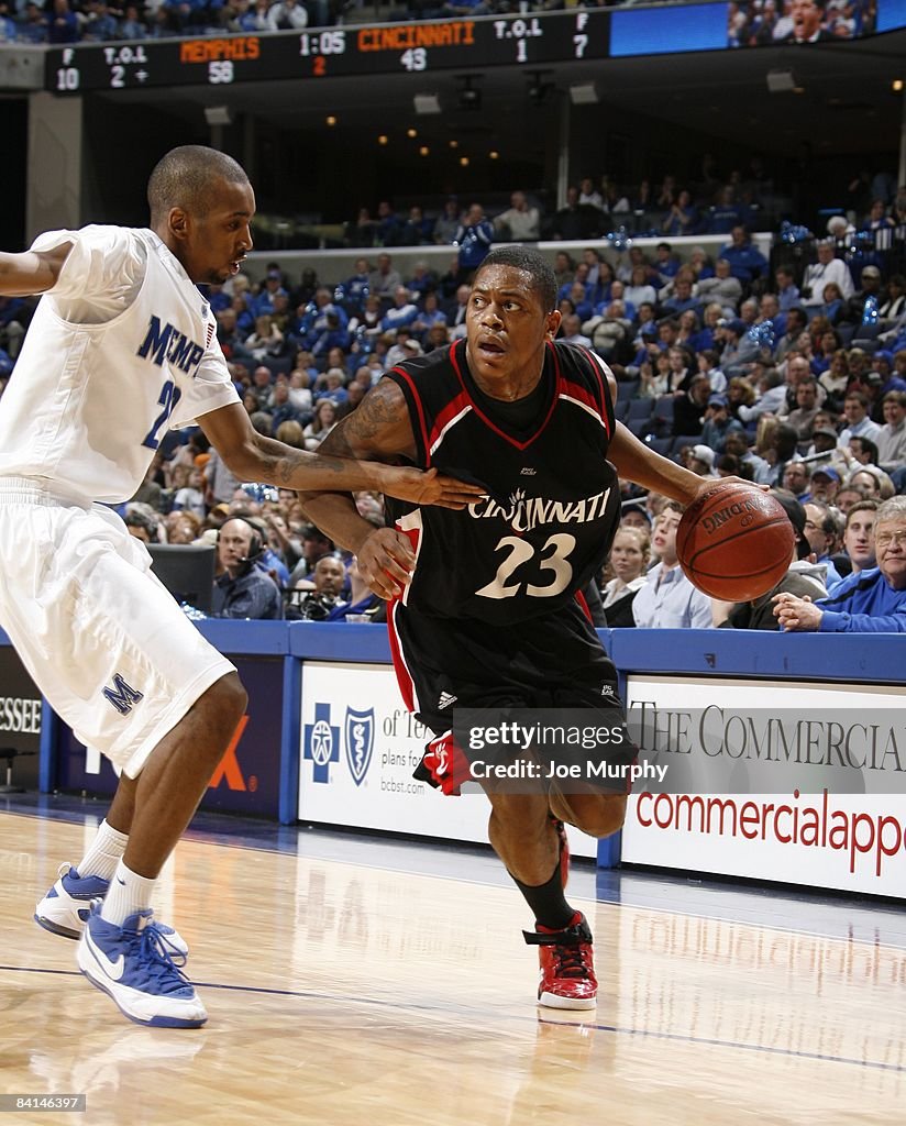 Alvin Rochell Mitchell Renton Alvin Mitchell of the Cincinnati Bearcats drives against Doneal Mack ...