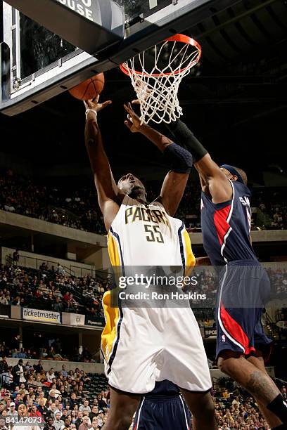 Roy Hibbert of the Indiana Pacers shoots over Josh Smith of the Atlanta Hawks at Conseco Fieldhouse on December 30, 2008 in Indianapolis, Indiana....