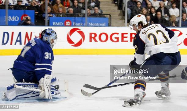Curtis Joseph of the Toronto Maple Leafs is beat on this play by Jim Slater of the Atlanta Thrashers during their NHL game at the Air Canada Centre...
