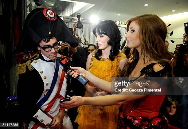 Canada hosts, Dan Levy and Jessi Cruickshank with singer Katy Perry at the 2008 Fashion Cares Gala at the Metro Toronto Convention Centre on November...