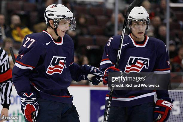 Drayson Bowman celebrates his first period goal with Jim O'Brien of Team USA during the game against Team Kazakhstan at the IIHF World Junior...