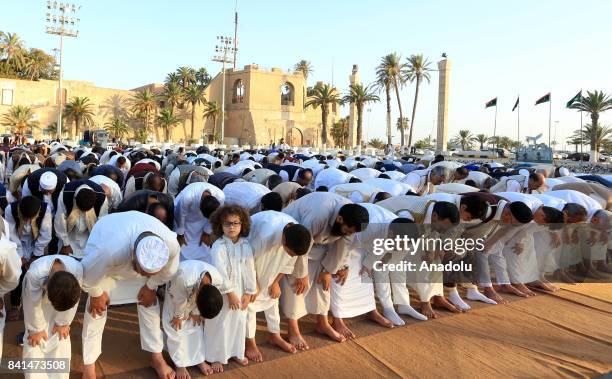 Muslims gather to perform the Eid Al-Adha prayer at Martyrs Square in Tripoli, Libya on September 01, 2017. Muslims worldwide celebrate Eid Al-Adha,...