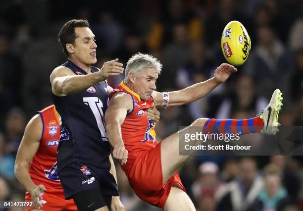 Anthony Koutoufides of Victoria and Adrian Fletcher of the All Stars compete for the ball during the 2017 EJ Whitten Legends Game between Victoria...