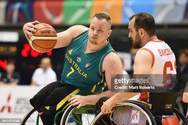 Shaun Norris of Australia takes on the defence during the Wheelchair Basketball World Challenge Cup match between Turkey and Australia at the Tokyo...
