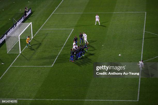 Michael McGlinchey of New Zealand shoots and scores from a free-kick against goal keeper Phillip Mango of Solomon Islands during the 2018 FIFA World...