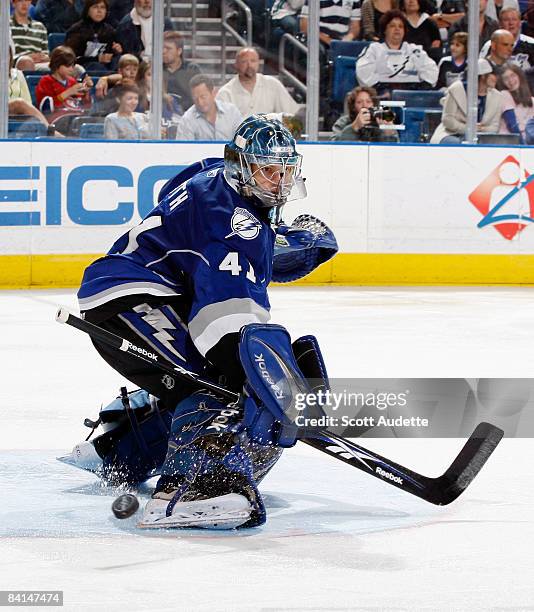 Goaltender Mike Smith of the Tampa Bay Lightning makes a save against the Montreal Canadiens at the St. Pete Times Forum on December 30, 2008 in...