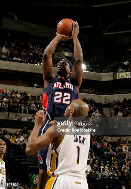 Flip Murray of the Atlanta Hawks shoots over Jarrett Jack of the Indiana Pacers at Conseco Fieldhouse on December 30, 2008 in Indianapolis, Indiana....