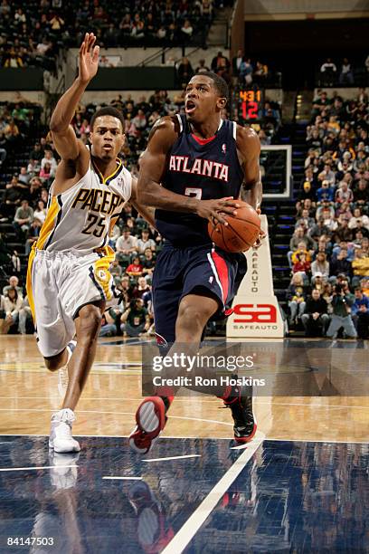 Joe Johnson of the Atlanta Hawks drives on Brandon Rush of the Indiana Pacers at Conseco Fieldhouse on December 30, 2008 in Indianapolis, Indiana....